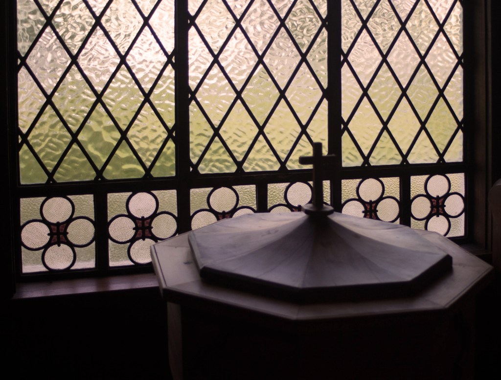 St David's interior, font and stained glass window detail
